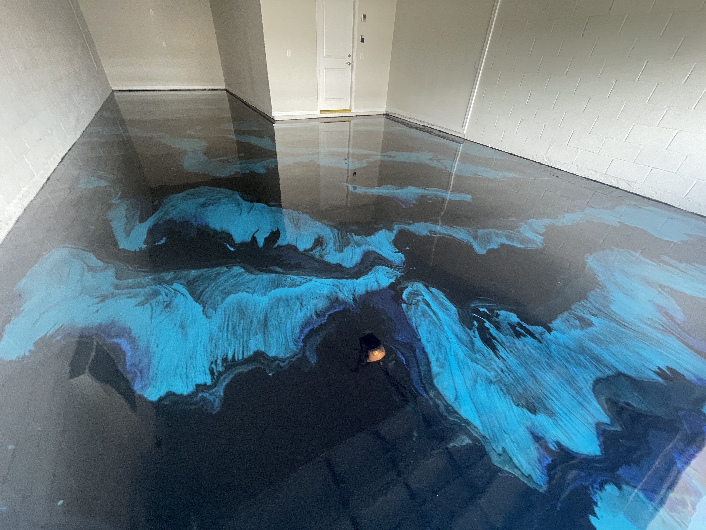 Stunning blue metallic epoxy floor installation by S&S Concrete Coating in St. Augustine, Florida