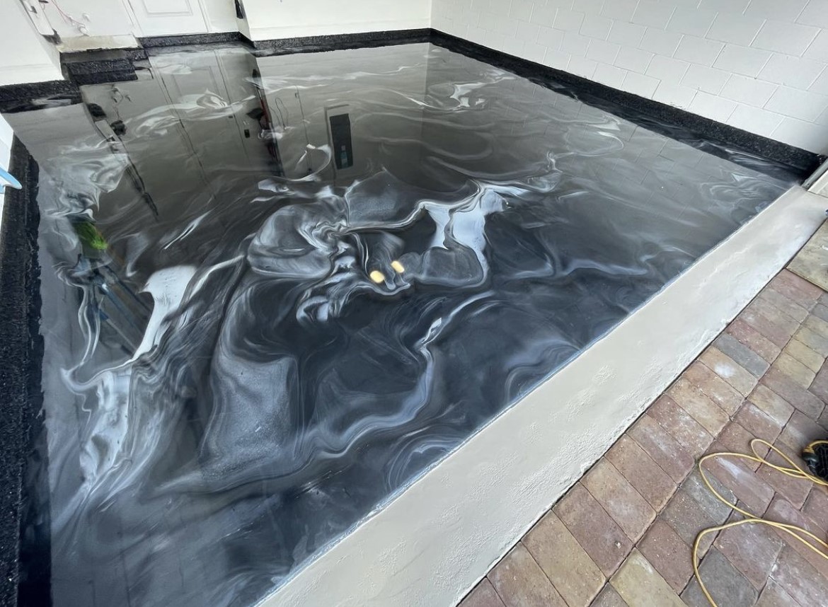 Dark metallic epoxy floor design for residential home in St. Augustine
