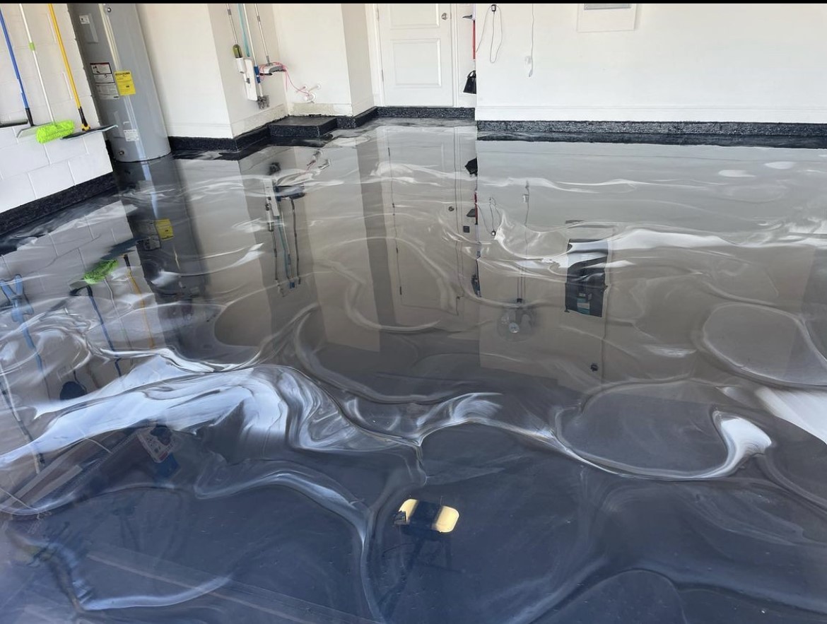 Silver metallic epoxy flooring installation in Northeast Florida home